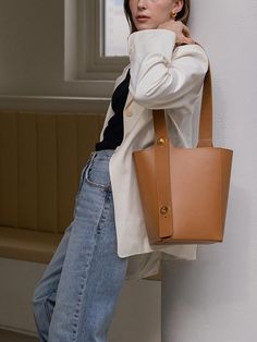 For unique designs and high-quality products, REFRAME pursues craftsmanship through the entire domestic handmade process.- Two-way bucket bag made of Italy leather- Can be worn in two ways: shoulder or cross bag- Gold satin turn lock and saltledge decoration- Durable bag with generous size Versatile Beige Bucket Bag, Versatile Bucket Hobo Bag For Office, Trendy Brown Bucket Bag For Office, Trendy Brown Office Bucket Bag, Beige Bucket Shoulder Bag For Office, Versatile Office Bucket Shoulder Bag, Versatile Bucket Shoulder Bag With Leather Handles, Everyday Brown Satchel Bucket Bag, Chic Office Bucket Shoulder Bag