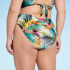 Flaunt cool, tropical style at the beach or pool with this Mid-Rise Hipster Bikini Bottom from Shade & Shore™. Made from soft fabric with spandex and full lining, this mid-rise hipster bikini bottom offers flexible movement in and out of the water. Designed with multicolored tropical floral print, it features an opaque, medium-coverage design for confident wear. Shade & Shore™: Found exclusively at Target. Fitted Swimwear With Palm Tree Print For Vacation, Green Bottoms For Pool Vacation, Tropical Triangle Top Swimwear For Vacation, Summer Tropical Print Swimwear For Pool, Beachwear Tropical Print Swimwear For Beach Season, Tropical Stretch Swimwear For Poolside, Tropical Tankini For Vacation Sunbathing, Tropical Print Beachwear For Beach Season, Beach Party Tropical Print Swimwear