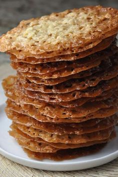 a stack of crackers sitting on top of a white plate