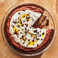 a chocolate pie with whipped cream and nuts on top