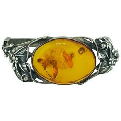 The handcrafted, original sterling silver amber bracelet holds an oval piece of amber gemstone with a history of its own. Amber is resin from ancient pine trees that has been hardened over a long period of time. Inside this amber you can see fossilized specs of a former life this gemstone once had. Amber is an extremely interesting stone that reflects an intense orange/caramel color. This original oval shaped amber is 34 mm long by 25 mm wide and is set in a sterling silver bezel and makes for a Modern Bangle, Flexible Bracelet, Orange Caramel, Amber Gemstone, Modern Bracelets, Sterling Silver Rings Set, Sterling Silver Bangle Bracelets, Vintage Bangles, Amber Bracelet