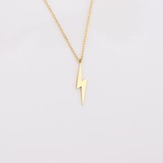 Your Lightning Bolt Necklace is stylish, dainty and pretty ideal for everyday use. Details of solid gold handmade Dainty Flash Jewelry are very eye-catching. It is a great gift for your loved ones. This jewelry will be an indispensable piece of yours. This meaningful Thunder Bolt Charm Necklace with high quality handwork will be a legacy you can leave to your family its. * Lightning Bolt Necklace Details * Material / Gold Kt : This elegant necklace is made of 14k and 18k Solid Gold * Available G Dainty 16-inch Yellow Gold Charm Necklace, 16 Inch 14k Gold Chain Necklace For Gift, 14k Gold Jewelry As Gift, 16 Inch Length, 14k Gold 16 Inch Chain Necklace As Gift, Minimalist 14k Gold Hallmarked Necklace, 14k Gold Necklace 16 Inch Length, Gift Jewelry In Yellow Gold, 16 Inch Length, 16 Inch Yellow Gold Jewelry As A Gift, Dainty 16 Inch Yellow Gold Necklace