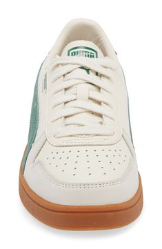 This throwback sneaker emerges from the '80s archives and maintains its sleek silhouette with a low-profile, leather upper and contrast side stripes. Lace-up style Removable insole Leather upper/leather and textile lining/rubber sole Imported Retro Mid-top Skate Shoes With Perforated Toe Box, Retro High-top Sneakers With Perforated Toe Box, Retro Leather Sneakers With Gum Sole, Sneaker Men, Side Stripe, Up Styles, Low Profile, Rubber Sole, Leather Upper