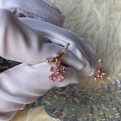 The cutest pink sakura cherry blossom flower star ear climber, ear crawler, ear stud earrings, delicate dainty beauty handmade of pink cz crystal and 14K Gold plated sterling silver, it shines gorgeously from every angle! Adorable girly feminine vibes, yet elegant and chic, goes perfect with everyday/occasions/bridal or bridesmaid look! Definitely a cute gifts idea. ♥ All of our jewelry are carefully handmade with delicate and exquisite details, all designed and made in Manhattan, New York. 💎 Features: ♥ Made to Order ♥ Material: 14K Gold plated sterling silver ♥ Main stone: pink crystal gemstone ♥ Side Stone: Cz crystal ♥ Push back Closure 💎 Details: ♥ Approximate Measurements: - Length: 0.45“ - Width: 0.6” ♥ Lightweight, easy to wear ♥ Nickel/Lead Free, Hypoallergenic 💎 Packing & Ship Pink Drop Earrings For Her, Pink Drop Earrings As Gift For Her, Rose Gold Ear Climbers As Gift, Rose Gold Ear Climbers With Ear Wire As Gift, Dainty Pink Flower Earrings, Dainty Pink Flower-shaped Earrings, Pink Earrings With Ear Wire For Her, Pink Flower Earrings For Her, Pink Flower Earrings Gift For Her