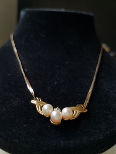 "This vintage 10K Yellow Gold bib necklace is encrusted with 3 Buttery natural round shaped Beige pearls, and 3 tiny clear diamonds. These gemstones are genuine and have been tested. This bib necklace came from an Estate Sale in Thornton, Co and the woman stated that she purchased it in the 1980's and has all original parts. She mentioned that the chains at one time had got tangled with another chain and she had to untangle that is why the chains look like that. They are not broken at all just a Vintage Yellow Gold Necklace With Diamond Accents, Vintage Pearl Chain Jewelry For Anniversary, Vintage Formal Necklace With Pearl Pendant, Vintage Pearl Pendant Necklace For Formal Occasions, Vintage White Necklace With Diamond Accents, Formal Costume Jewelry Necklace With Pearl Pendant, Formal Costume Jewelry With Pearl Pendant, Pearl Costume Jewelry Necklaces For Anniversary, Vintage Round Pearl Drop Necklace