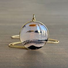 This peaceful disc brings to mind a horizon in miniature, cut, polished, and set in its snug golden bezel by artist Mimi Favre 18k yellow gold Montana agate 27mm (1 1/16") in diameter1.3mm chain is 18" long Montana Agate, Organic Style, Newport Ri, Keshi Pearls, Tahitian Pearls, Pearl Grey, Pearl Drop, Newport, Gold Chains