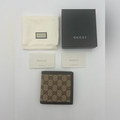 Authentic Gucci Bifold Wallet Brown Canvas Gg Canvas Leather Lining & Single Interior Pocket With Card Slots Flap Closure Includes Gucci Box & Dust Bag Measurements: Height: 3.25" Width: 5.25" Depth: 0.25" Gucci Brown Formal Wallet, Formal Brown Gucci Wallet, Gucci Bifold Wallet With Original Box, Luxury Brown Gucci Wallet, Designer Gucci Bifold Wallet, Gucci Designer Wallet For Formal Occasions, Designer Brown Bifold Wallet, Designer Bifold Wallet, Bridal Logo