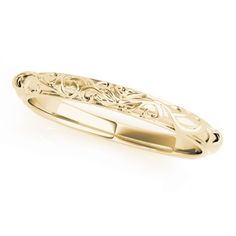 a yellow gold wedding band with an intricate design on the front and side, set against a white background