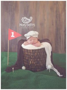 a baby is laying in a basket with a flag