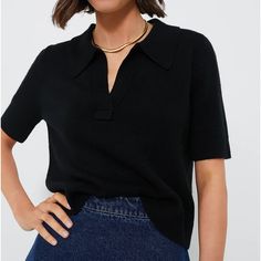 On-Trend And Elegant As Ever, The Black Henry Polo Is An Elevated Basic That Deserves A Spot In Your Closet. Crafted From A Smooth, Slightly Textured Luxe Knit, This Must-Have Top Combines Effortless Style And Comfort With Its Relaxed Yet Cropped Fit And Classic Polo Collar. Pair It With Jeans And Sneakers For An Everyday Casual Look, Wear It With Tailored Trousers And Ballets For Work, Or Style It With Skirt And Heels For A Cute Date Night 'Fit. Collared V-Neck Short Sleeve Ribbed Cuffs And Hem Black Fine Knit Short Sleeve Top, Classic Black Fine Knit Top, Black Fine Knit V-neck Top, Casual Black Knit Top With Ribbed Collar, Black Tops With Ribbed Collar For Work, Trendy Black Knit Top For Workwear, Trendy Black Knit Top For Work, Trendy Black Top With Collared Neckline, Chic Black Short Sleeve Knit Top