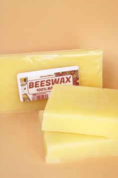 two pieces of beeswax soap sitting next to each other