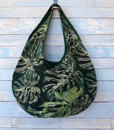 Beautiful handmade green leaves print hobo style bag for summer. Tropical beach bag, also can be used as a large shopping bag, market bag or purse. Fabric bag made from home decor fabric, very durable and long lasting tote bag. This hobo bag is handmade. I use only careful tested fabrics, so it would last for long time. The bag is one double sided, can be used from both sides (reversible), one side green leaves patterns print, other green cotton/polyester home decor fabric. About bag: Dimensions Summer Green Large Capacity Hobo Bag, Green Cotton Hobo Bag For Travel, Green Large Capacity Hobo Bag For Beach, Summer Green Hobo Bag For Daily Use, Casual Green Canvas Beach Bag, Green Cotton Hobo Bag For Daily Use, Summer Large Capacity Green Canvas Bag, Green Hobo Bag For Summer Travel, Green Canvas Bag For Vacation