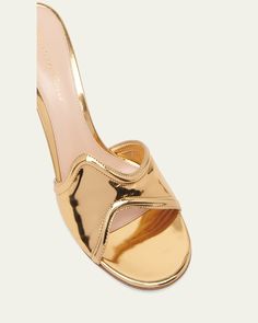 Gianvito Rossi metallic leather mule sandals     2.75 in / 70 mm stiletto heel    Open toe    Wavy wide band upper    Slide style    Leather outsole    Lining: Leather    Spot clean    Made in Italy Mule Sandals, Leather Mules, Wide Bands, Metallic Leather, Bergdorf Goodman, Gianvito Rossi, Stiletto Heel, Mule, Stiletto Heels