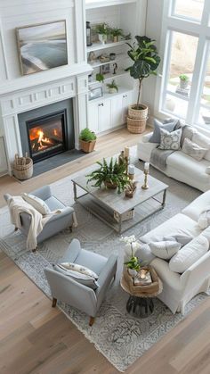 a living room filled with furniture and a fire place in the middle of the room