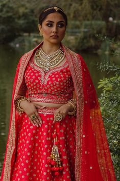 Kakar - Red Bridal Silk Indian Contemporary Lengha w/ Dabka work Live your fantasies come true in this one of a kind red bridal lehenga choli this bridal season! Dupion silk choli blouse w/ Dabka embroidery Sweetheart neckline choli blouse Luxurious dupion silk fabric blouse Mid-length sleeve with embroidery Beautiful Dabka embroidery all over Elaborately embroidered borderwork Lightweight dupion silk lengha w/ Dabka & Sequins Feather-light dupion silk skirt Yards of fabric used for max flare Go Red Dola Silk Lehenga For Traditional Ceremonies, Red Dola Silk Lehenga For Reception, Red Anarkali Lehenga In Raw Silk, Kundan Lehenga With Tilla For Navratri, Navratri Kundan Lehenga With Tilla Details, Kundan Choli With Tilla For Navratri, Kundan Tilla Lehenga For Navratri, Navratri Kundan Choli With Tilla Details, Traditional Red Dola Silk Lehenga