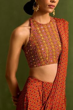 Orange pre draped saree with geometric print. Comes with dabka embroidered halter neck padded blouse, embellished by sequins, beads and mirrorwork. - Aza Fashions Festive Embellished Fitted Pre-draped Saree, Fitted Art Silk Embellished Blouse Piece, Multicolor Embellished Pre-draped Saree For Festive Occasions, Festive Embellished Blouse With Traditional Drape, Embellished Multicolor Pre-draped Saree For Festive Occasions, Festive Multicolor Embellished Pre-draped Saree, Embellished Blouse With Traditional Drape For Diwali, Multicolor Embellished Saree For Reception, Traditional Drape Top With Mirror Work For Party