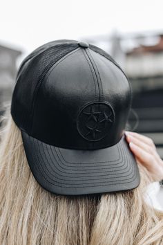 The elevated version of our classic TriStar trucker. Featuring a sleek black on black faux leather design, this trucker gives you a cool, comfortable style, no matter the occasion. Unisex 6 Panel High Crown Structured Adjustable Snapback Closure Poly/cotton blend Black Leather Trucker Hat For Outdoor, Black Trucker Hat With Leather Patch, Black Leather Trucker Hat With Leather Patch, Black Leather Trucker Hat, Casual Black Trucker Hat With Leather Patch, Trendy Black Trucker Hat For Everyday, Casual Leather Trucker Hat, Comfortable Style, Black On Black