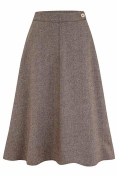 Our wool blend Herringbone skirt is inspired by the flared designs of the 1940s and 50s. Drawn from an era of classic silhouettes and 1940s glamour, this sophisticated and feminine piece will transport you back in time. The knee-length a-line skirt defined the post-war era of the late 40s and 50s. Its beautifully flowing shape flattered the wearer and helped create the hourglass shape so desired at the time. The wool blend is practical and durable, adding to the drape of the skirt and giving it perfect movement, whilst decorative details such as the Curozo button adds another delicate touch. Our Herringbone skirt is perfect to wear with a blouse for classic vintage chic or a sweater for the cooler months.  Visit our blog page to see how we developed our skirt design.  * Corozo button and z 1940s Glamour, Herringbone Skirt, 1940s Style, Hourglass Shape, 1940s Fashion, Skirt Design, Looks Vintage, Vintage Chic, A Line Skirt