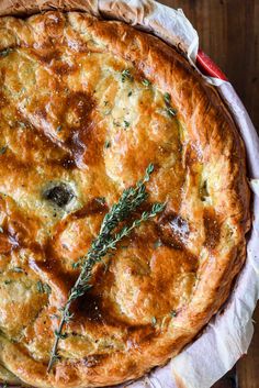 a baked pie with herbs on top