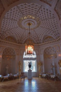 an ornately decorated room with chandeliers and tables