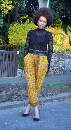 "Joggers in African print with mustard and orange as the primary colours. It has deep side pockets and the fit is relaxed with an elasticated waist making sizing flexible. Model 5ft9\" and wears a UK 10/12.  Belt available in shop to order. Length- 40\" 100% cotton  Made in Ghana Fabric care  Wash in cool water. Iron on medium heat.  Dry away from sunlight." Yellow Ankle-length Pants With Elastic Waistband, Yellow Pants With Side Pockets, Yellow Straight Pants With Elastic Waistband, Yellow Pants With Elastic Waistband, Yellow Harem Pants With Pockets, Yellow Ankle-length Harem Pants With Pockets, Ankle-length Yellow Pants With Pockets, Yellow Ankle-length Pants With Pockets, Yellow Elastic Waistband Harem Pants