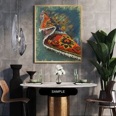 a painting hanging on the wall above a table