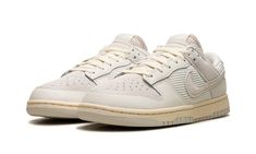 The Nike Dunk Low “Phantom/Light Bone” is a colorway of the retro basketball shoe with an interesting mixture of materials.  On the Dunk Low “Phantom/Light Bone,” the upper features a knit and ribbed textile materials on the midfoot, collar, and tongue panels.  Suede can be found on the perforated toe and heel.  A classic Swoosh logo appears on the sides of the shoe.  Exposed foam padding can be seen on the tongue, giving the shoe a “DIY” vibe.  Underfoot, a Coconut Milk-colored rubber midsole a Trending Sneakers For Men, Milk Color, Retro Basketball Shoes, Retro Basketball, Bone Shoes, A Basketball, Swoosh Logo, Stadium Goods, Trending Sneakers