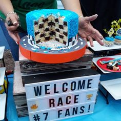 a cake is being served at a race event