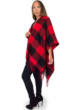 "This cozy chic knit poncho features a bold buffalo plaid print with fringe trim, and lightweight, flowing material that is comfortable and warm. Wear with your favorite boots for a stylish, yet casual look on chilly days. Material: 100% Acrylic Sizing: One size fits all Garment Measurements: 46\" x 55\" Model Measurements: Bust: 32\" Waist: 26\" Hips: 36\" Height: 5'5 See more colors and prints here: https://www.etsy.com/shop/DaisyDelSolDesigns?section_id=24478765 We are taking steps towards su Red Oversized Poncho For Winter, Oversized Red Poncho For Winter, Red Shawl Cape For Fall, Winter Plaid Poncho, Plaid Winter Poncho, Fall Red Shawl Cape, Casual Red Cape For Autumn, Casual Red Cape For Fall, Casual Plaid Poncho For Winter