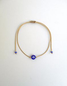 Evil eye bracelet Beige string Evil eye jewelry Evil eye women Evil eye men Greek evil eye Protection amulet Evil eye talisman Evil eye gift This simple yet beautifull bracelet is made using durable beige waxed string and has a glass beed evil eye charm in the middle,and blue seed beads at the ends. It is adjustable with a sliding knot closure. Other charm bracelets in my shop: https://www.etsy.com/shop/LuckyRatJewellery?section_id=16685466&ref=shopsection_leftnav_3 Other evil eye bracelets from Adjustable Evil Eye Bracelets For Meditation, Adjustable Evil Eye Jewelry Gift, Adjustable Evil Eye Jewelry For Gift, Adjustable Evil Eye Jewelry For Everyday, Adjustable Amulet Bracelets As Gift, Symbolic Evil Eye Bracelets As Gifts, Adjustable Amulet Bracelet Gift, Adjustable Amulet Bracelet As Gift, Traditional Evil Eye Bracelet For Gift