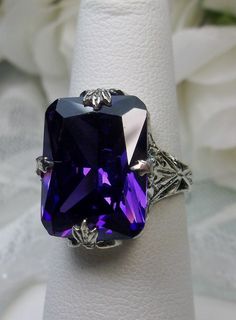 10ct Rectangle Purple/Amethyst CZ Solid Sterling Silver Art Deco Filigree Ring Size (Made to order) (Design #15) https://etsy.me/2nYEd1Q #jewelry #ring #silver #etsy #loveetsy #shopsmall #yes #purple #cubiczirconia #floral #rectangle Art Deco Filigree, Mystic Fire Topaz, Stock Design, Purple Amethyst Ring, Order Design, Purple Band, Sterling Silver Filigree, Lovely Ring, Silver Art