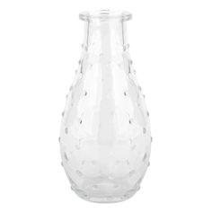 a clear vase with white dots on it