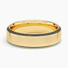 a yellow gold wedding band with black diamonds