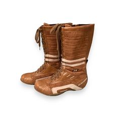 a pair of brown boots sitting on top of each other