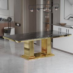 an elegant dining table with gold legs and marble top in the middle of a kitchen