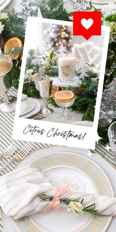 the table is set for christmas with white dishes and silverware