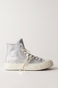 Metallic suede uppers make these high-top Converse a step above the rest. **Features:** High-top style, metallic suede uppers, rubber toe cap, rubber outsole, lace-up closure **Why We | Chuck 70 Suede Shimmer High Top Sneakers by Converse at Free People in Silver, Size: US 8 M Suede High-top Sneakers With Gum Sole, Fall Season Suede High-top Sneakers For Streetwear, Fall Suede High-top Sneakers For Streetwear, Metallic Sneakers With Speckled Midsole For Streetwear, High-top Sneakers With Gum Sole, Modern Converse Leather High-top Sneakers, High-top Sneakers With Gum Sole For Fall, Fall High-top Sneakers With Gum Sole, Modern Suede High-top Sneakers