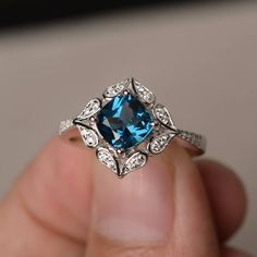 This is a gorgeous handmade creation. Its beauty is its simplicity & Elegance. The 7*7 mm cushion shape faceted London Blue Topaz is crafted in solid sterling silver and with rhodium plated. All item is sent in a beautiful gift box If you have any idea of design your ring,pls contact me directly. You can realize more lovely stuff clicking the link https://www.etsy.com/shop/knightjewelry?refshopsection_shophome_leftnav Please leave the correct address and you phone number for delivering succe Purple Rings, Ring Cushion, Cushion Cut Ring, London Blue Topaz Ring, Cushion Ring, Magical Jewelry, Pretty Rings, London Blue Topaz, Blue Gemstones