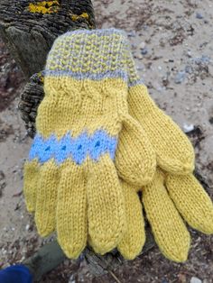 The gloves are hand knitted from 100% Norwegian wool and hand knitted in Iceland by local craftsmanship, each pair of mitten is unique from Guddawool and each has it's special design pattern.  Wool type: Sandnes - Norwegian wool Length of mitten: 10.24 inch/ 26 cm - One size/unisex size Free International shipping with tracking! Handmade Winter Knitting Pattern In Yellow, Handmade Yellow Knitting Pattern For Winter, Scandinavian Winter Handmade Knitting Pattern, Winter Yellow Knitting Pattern, Fitted Wool Knitting Pattern, Hand Knitted, Winter Gloves, Special Design, Mitten Gloves, Iceland