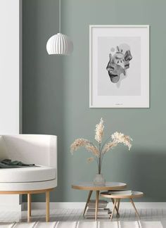 a living room with green walls and white furniture