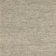 an area rug that is made up of various types of fabric, including grey and white