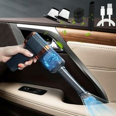 a woman is cleaning the inside of her car with a handheld vacuum and steam cleaner