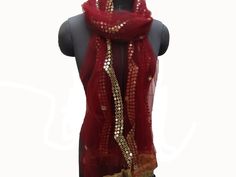 Pattern - an embroidered scarf. Ideal for -  women/ girls. Occasion -   formal or casual.  Fabric - fine net, has a fine texture with a nice fall. Color - maroon with golden thread and foil sequin embroidery.  Size - 38 x 80 inches approx.  Can be wrapped in different styles. Care - gentle hand wash. Festive Shawl Scarf For Party, Elegant Embroidered Scarves For Festive Occasions, Festive Party Shawl Scarf, Elegant Burgundy Embroidered Dupatta, Elegant Burgundy Dupatta With Zari Work, Elegant Eid Silk Scarf Dupatta, Elegant Wedding Scarves For Festivals, Elegant Silk Dupatta Scarf For Eid, Elegant Dupatta Silk Scarf For Eid