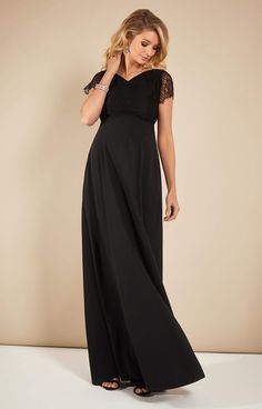 Eleanor is the ultimate full length maternity gown for the most special occasions. A perfectly tailored bodice in exquisite leavers lace, with intricate detailing to the shoulders and sleeves, flows into a fully dramatic, opulent skirt with the most beautiful drape. •Wonderful heavyweight matte crepe satin •Full length opulent skirt for dramatic swish •Feminine subtle v-neck •Scalloped sleeve detail •Concealed back zip •Intricate shoulder detail • Lovingly designed and made in Britain Floor-length Bridesmaid Dress With Lace Bodice, Floor-length Evening Dress With Lace Bodice, Maxi Length Evening Dress With Lace Trim For Gala, Lace Gown With Sweep Train For Gala, Elegant Floor-length Maternity Dress For Wedding, Lace Maxi Dress With Sweep Train For Wedding, Formal Maxi Length Lace Dress With Lace Bodice, Lace Maxi Dress With Lace Back For Gala, Gala Gown With Lace Sleeves And Fitted Bodice