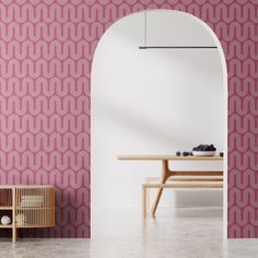 a room with pink wallpaper and a wooden table