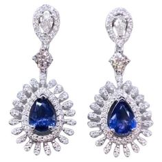 An exclusive pair of earrings in contemporary design, so elegant and refined style . Stunning earrings come in 18k gold with 2 pieces of Ceylon Sapphires , in perfect pear shape, fine quality and grade , and 170 pieces of Natural Diamonds, in mixed cut , of 2,10 carats. .F-G color VS clarity, very sparkly. Handcrafted by artisan goldsmith. Complete with AIG report. Extremely HIGH Quality Product. Shop with Confidence. We can offer free worldwide shipping, taxes free on my shipment. Earring Video, 18k Gold Bracelet, Modern Bracelets, 18k Gold Earrings, Ceylon Sapphire, Refined Style, Sapphire Stone, Stunning Earrings, Modern Earrings