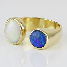 Unique 18k Yellow Gold Australian Opal And Deep Blue Opal Cuff Anniversary Ring This Ring Is Made Of 18 Karat Yellow Gold And Contains Two Beautiful Opal Gemstones. One Stone Is A Traditional White Opal & The Other Is A Deep Blue Opal. The Opals Are Placed At The Ends Of Each Side Of The Ring’s Cuff-Style Band. This Size 6 Ring Is Stamped "18k" And Can Be Resized By Any Qualified Jeweler. Size: 6 (Resizable) Metal: 18 Karat Yellow Gold Weight: 6.50 Dwt / 10.11 Grams Gemstones: Australian White Opal (9.50mm X 7.75mm) & Blue Opal (6.5mm) 19512-1*E Payment Receipt, Australian Opal, White Opal, Anniversary Ring, Blue Opal, Opal Gemstone, Womens Jewelry Rings, Anniversary Rings, Earings Piercings