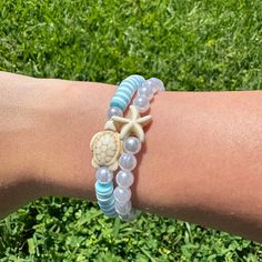 Here's my beachy blue turtle bracelet set! It comes with a blue + white bracelet with a turtle & a pearl + starfish bracelet! Hope you guys like it!! (Colors may be a bit different in real life) White Strand Bracelets With Starfish Charm, White Starfish Bracelet With Ocean-inspired Style, Casual Starfish Bracelet For Summer, Casual Adjustable Starfish Beaded Bracelets, Casual Starfish Bracelets As Gift, Casual Starfish Bracelet As Gift, Casual Starfish Bracelet For Gift, Casual Blue Beaded Bracelets With Starfish Charm, Casual Starfish Bracelet