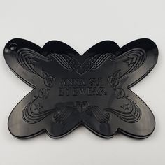 an image of a black butterfly shaped object