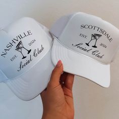 two white hats that say nashville and scottsdale with the names of each wine glasses